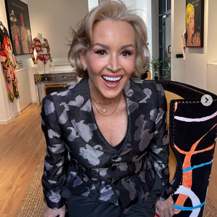Woman sitting on a colorful chair in an art gallery
